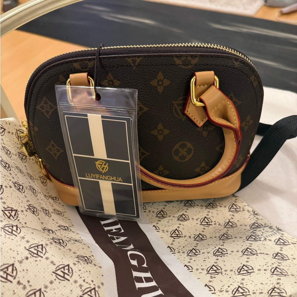 Brand new purse tags on with package